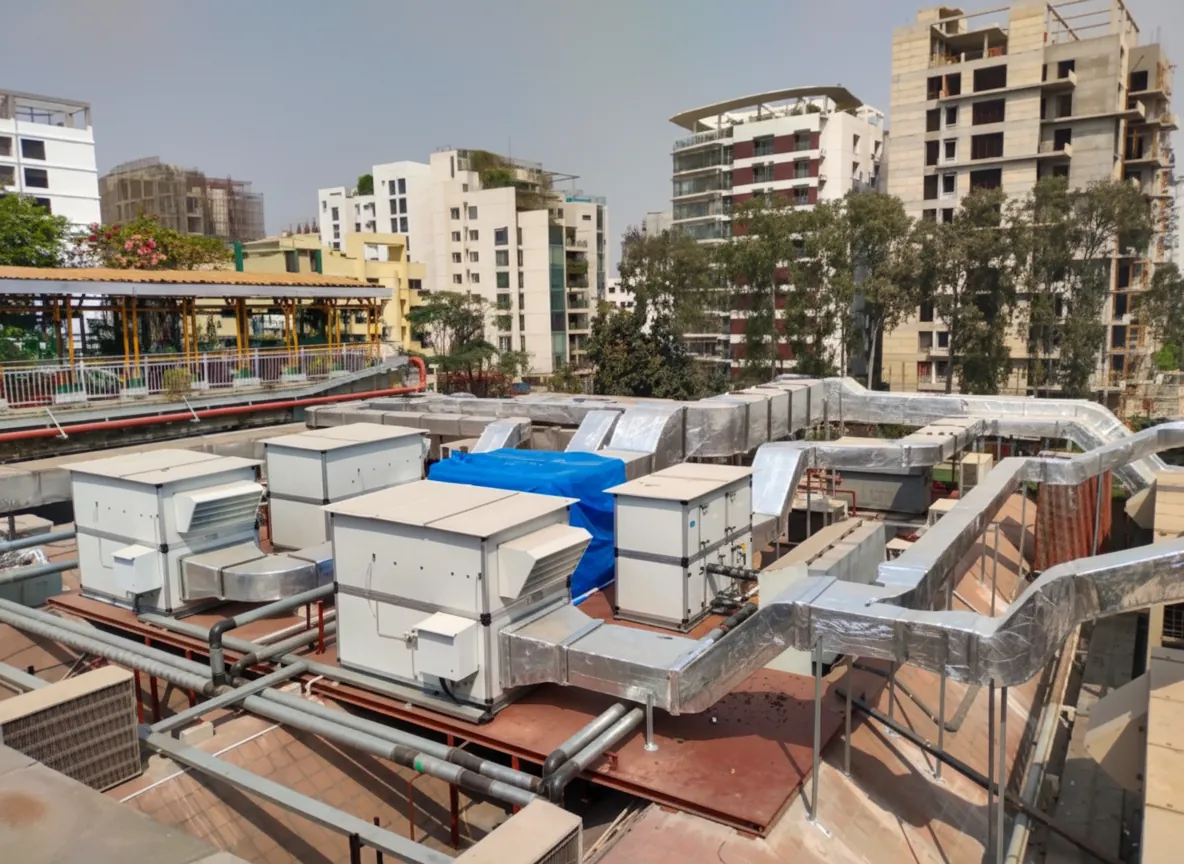 Rooftop Air Handling Units (AHUs) with insulated galvanized iron ductwork.